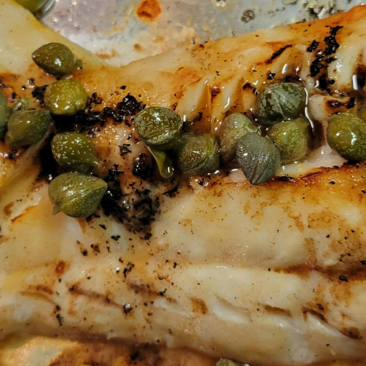 Broiled lemon butter cod with capers.