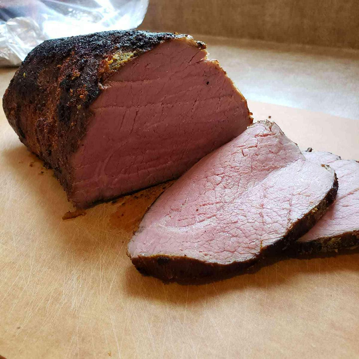 Eye of round roast seared with mustard and garlic crust.