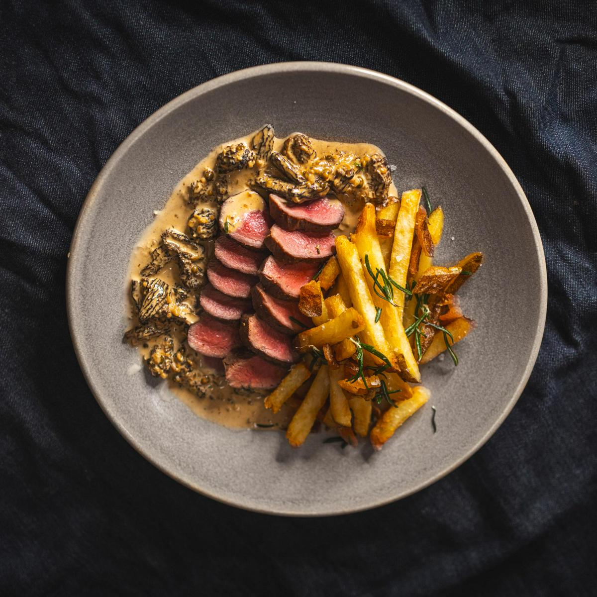 Venison Steak Frites with Bourbon, Wild Morel, and Mustard Sauce