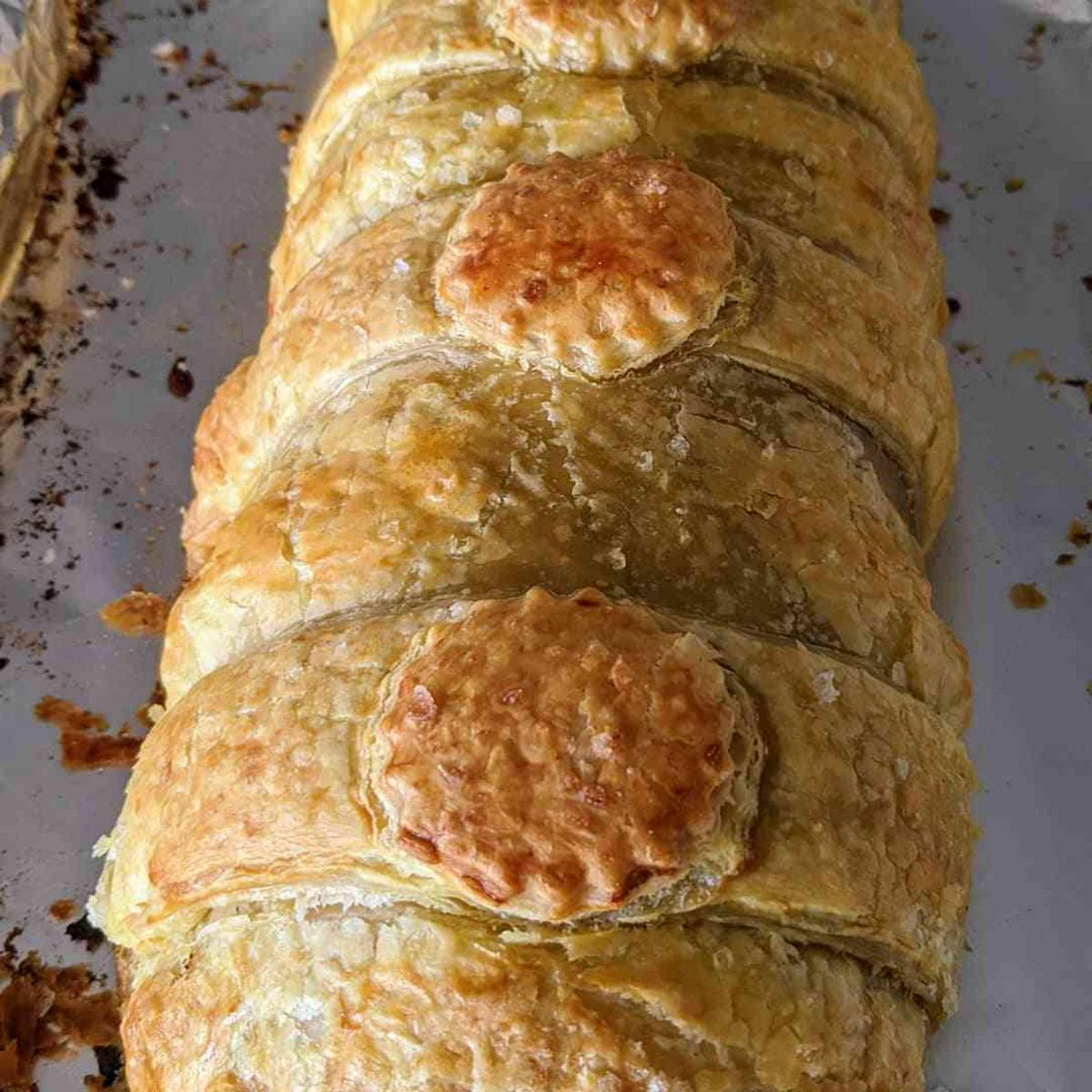 Beef Wellington with Caramelized onions and Boursin cheese.